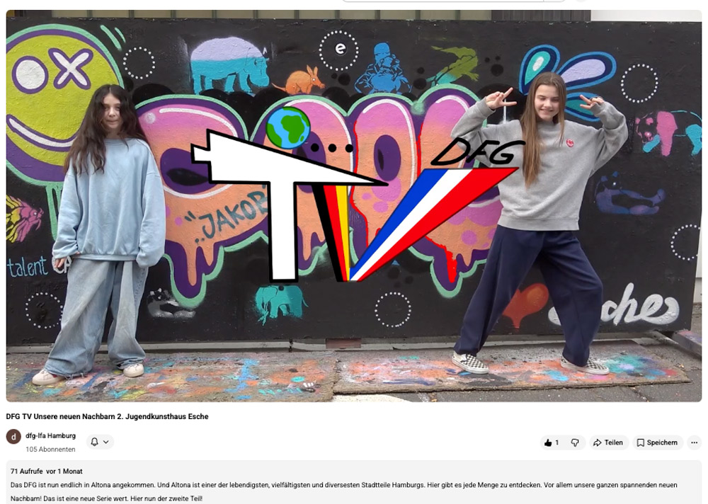 Screenshot von Youtube mit zwei jungen Reporterinnen vor unserer Graffiti-Wand.